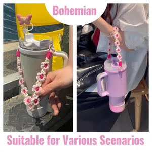Pink Bohemian crochet flower water bottle strap with butterfly straw cover accessory