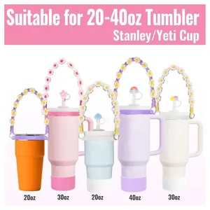 Pink accessories set for Stanley tumbler including daisy handle strap and silicone straw covers