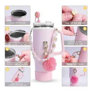 Pink 40oz tumbler accessory set with flower straw cover and woven handle strap