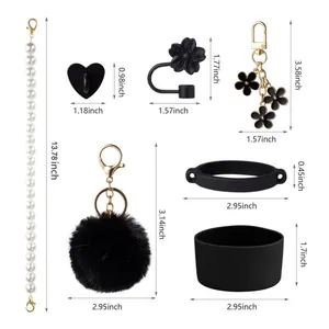 Black and white accessory set for water bottles including lanyard, hook, and silicone boot
