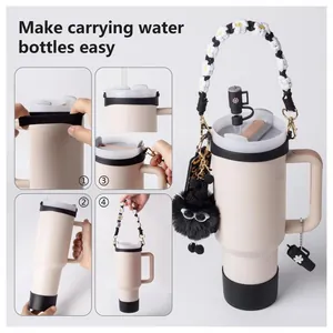Water bottle accessory set with handle strap, straw cover, and silicone boot on tumbler
