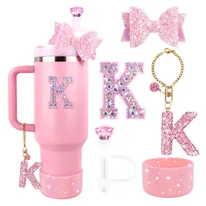 Pink glitter tumbler set with straw topper bow and initial K charm for Stanley cups