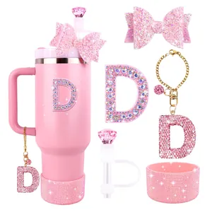 Close-up of pink straw cover bow and rhinestone initial D pendant for tumbler cups