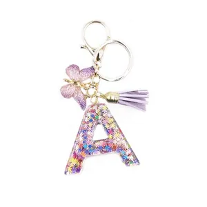 Resin letter A keychain with purple tassel, butterfly pendant and colorful sequins