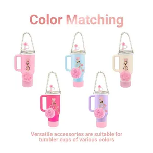 Pink Stanley cup accessory set with silicone boot pearl chain and fuzzy pom pom charm