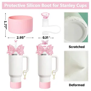 Pink Stanley cup accessory set with silicone boot, straw cover and glitter bow charm