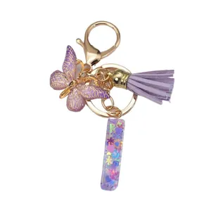 Porte-clés 26 Lettres Initiales en Résine Papillon Violet Gland Fermoir Mousqueton Doré Pendentif pour Sac à Dos Sac à Main Cadeau pour Femmes Filles