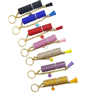 Sparkly rhinestone perfume bottle keychains in seven colors with matching tassels
