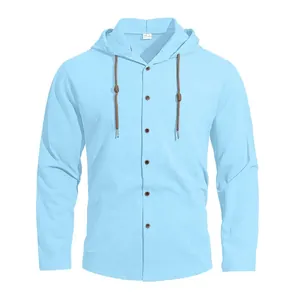 Men's light blue hooded cotton shirt with buttons and brown drawstrings on white background