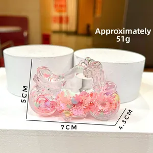 Detail of creative motorcycle drifting bottle keychain with pink sequins and glitters