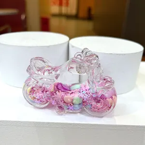 Close-up of pink motorcycle drifting bottle with floating sequins and heart beads