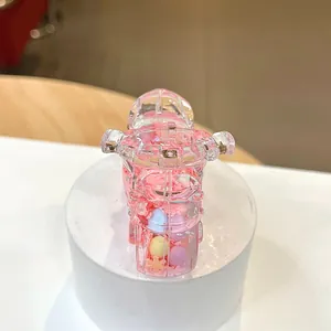 Macro shot of creative pink motorcycle keychain with colorful liquid quicksand beads