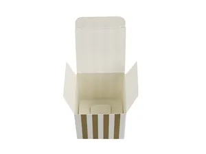 Detail of square striped gift box with ring insert and gold vertical lines decoration