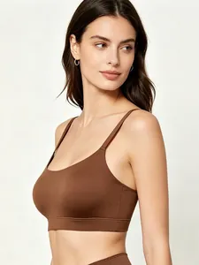 Side view of seamless brown wireless bra with thin straps and elastic wide band