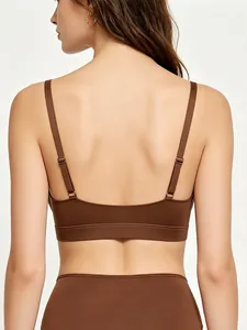Detail view of seamless chocolate brown sports bra with adjustable straps and wide elastic band