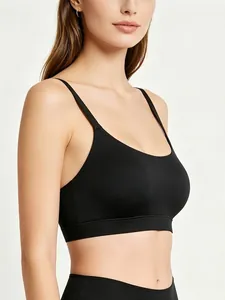 Side view of black seamless sports bra with thin straps and round neckline