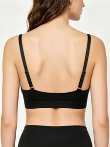 U-shaped back detail of black seamless bra with slim adjustable straps and elastic band