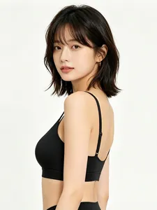 Close-up of black seamless elastic sports bra with adjustable thin straps and wide band