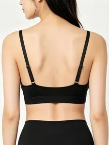 Detailed back view of black seamless sports bra with adjustable thin straps and wide hem