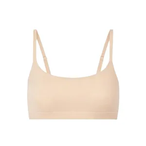 Seamless stretch round neck bralette with thin straps in a soft nude finish