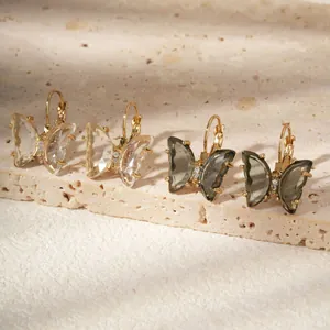 Elegant crystal butterfly stud earrings set with gold finish and zircon details