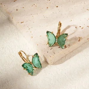 Elegant gold butterfly earrings with translucent green crystals and leverback clasp