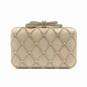 Champagne gold evening clutch with rhinestone diamond pattern and crystal bow clasp