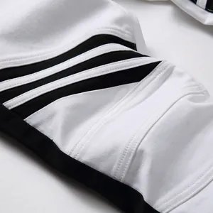 Men's slim fit black and white patchwork jeans with moto ribbed detail on knees