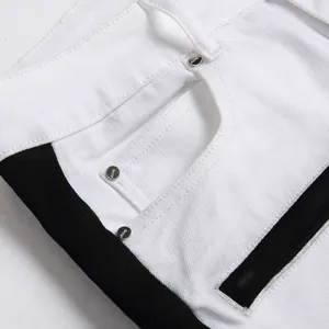 Men's slim fit white jeans with black side stripes and metallic rivet pocket details