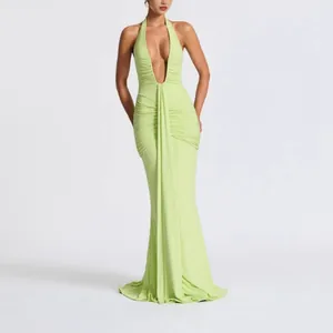 Elegant lime green halter neck maxi dress with deep V-neck and mermaid hem design