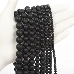 Matte black agate beads shown in seven different sizes for jewelry making comparison
