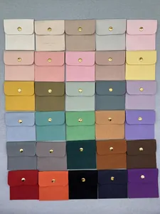 Detailed grid display of 30 colorful microfiber suede jewelry pouches with gold snaps
