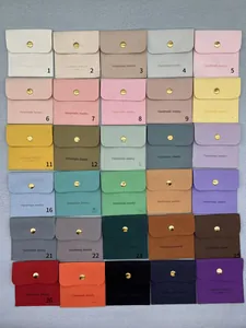 Detailed grid display of 30 colorful microfiber suede jewelry pouches with gold snaps