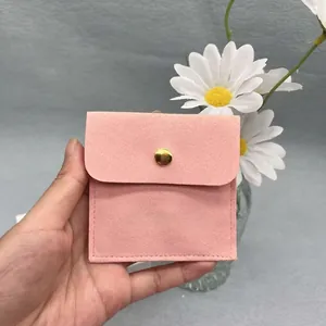 Pink microfiber suede jewelry pouch with gold snap button and handmade jewelry text