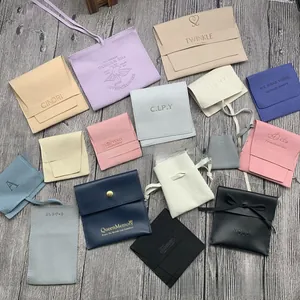 Detailed flat lay of colorful microfiber suede jewelry pouches with various closure styles
