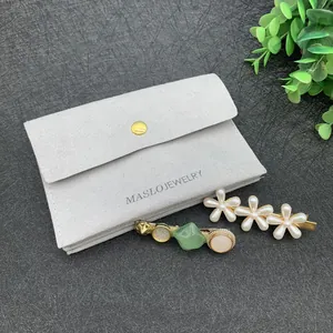 Microfiber jewelry pouch with metal snap button and elegant flower hair accessories set