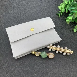Microfiber jewelry pouch with metal snap button and elegant flower hair accessories set