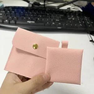 Pink microfiber jewelry envelope pouch with gold snap button and matching display card