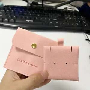 Pink microfiber jewelry envelope pouch with gold snap button and matching display card