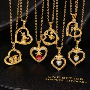 Close-up of golden graduation heart necklaces with Class of 2006 engraving and gem details