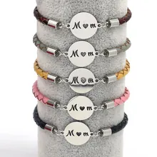 Detail view of woven leather bracelets in five colors with M heart M engraved charms