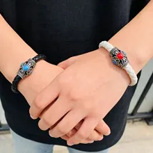Detail showing 4mm braided leather bracelets with retro metal clasps and colorful beads
