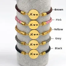 Detail view of woven leather bracelets with gold Mom charms in five assorted colors