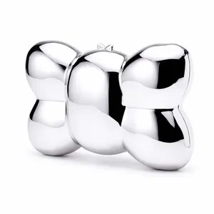 Macro shot of silver acrylic 3D bow evening bag with reflective mirror finish