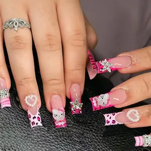 Pink gradient press-on nails with Hello Kitty, leopard print, and pearl heart accents