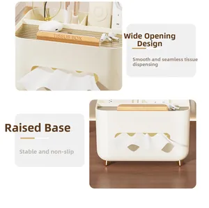 Detail of cream tissue box with gold trim, wide paper slot and multi-grid storage top