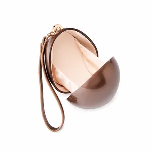 Detailed interior of shell-shaped acrylic evening clutch bag with glossy finish