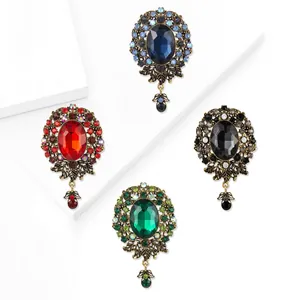 Vintage Baroque brooches with large colorful crystals and rhinestones in four elegant colors