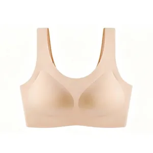 Close-up of seamless beige U-neck sports bra with wide straps and smooth fabric