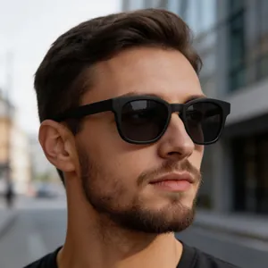 Close-up of classic matte black polarized sunglasses with metallic rivet detail on the temple